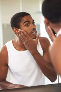 men washing his face to leave a great 1st impression
